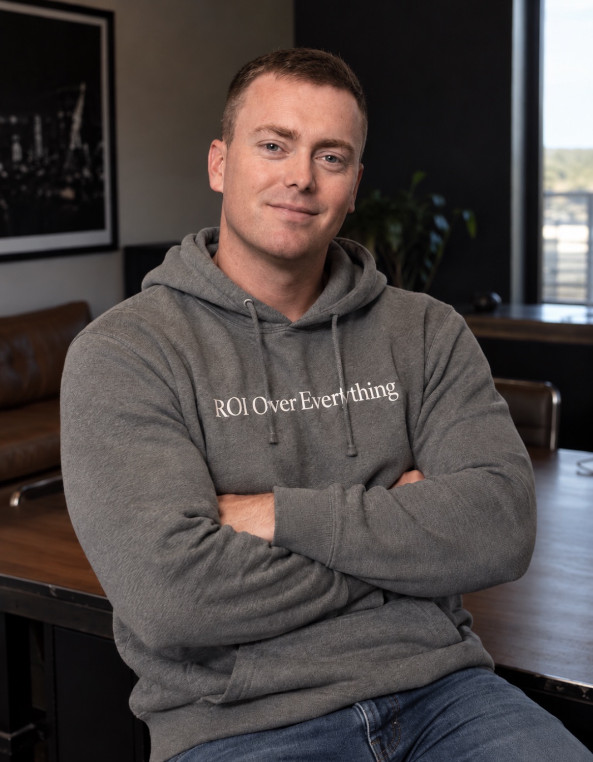 Dylan Hamm, host of the GoHamm Podcast, arms crossed in a GoHamm hoodie